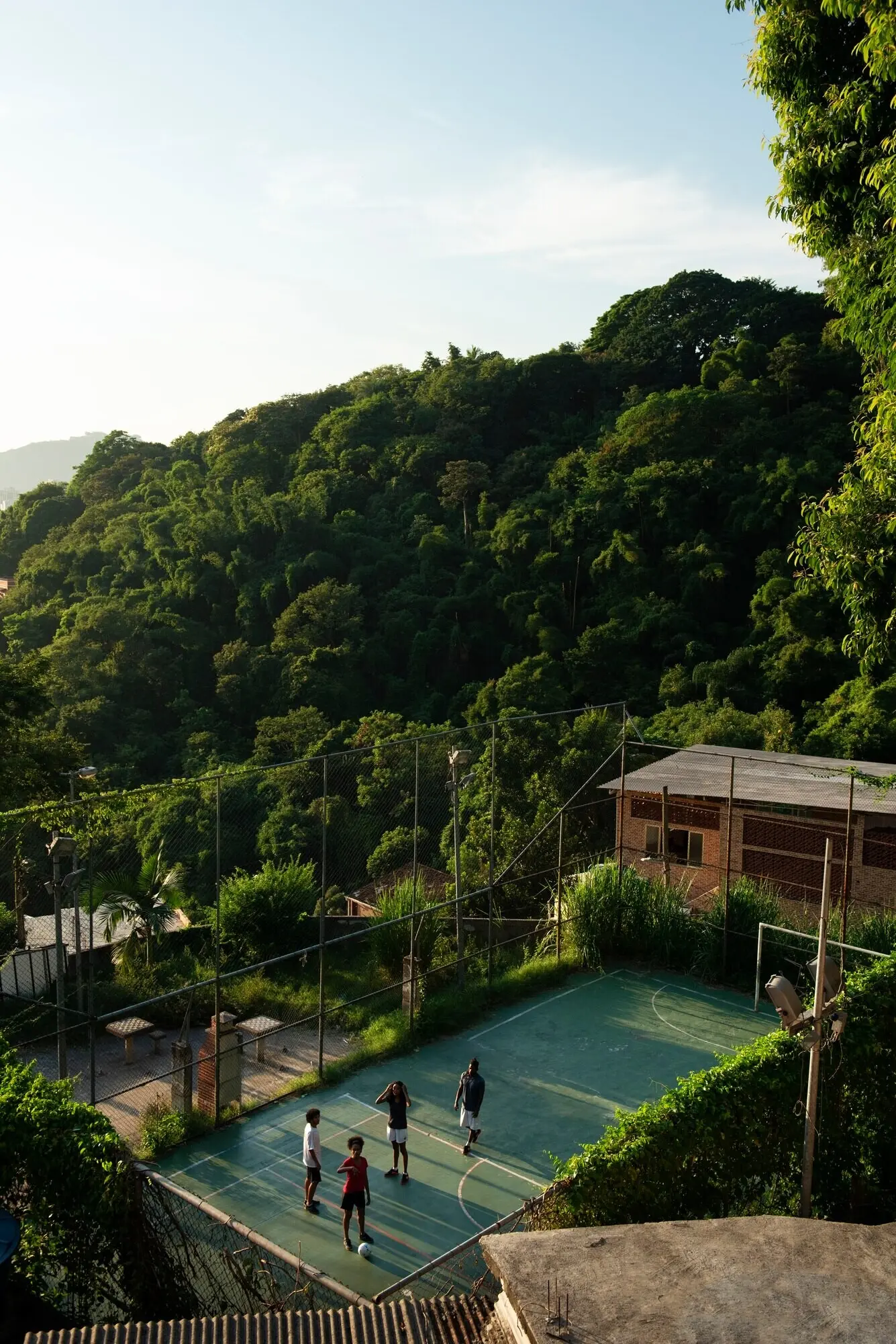 Long shot of friends playing soccer